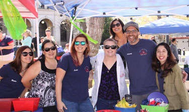 A group of volunteers pose for a photo together