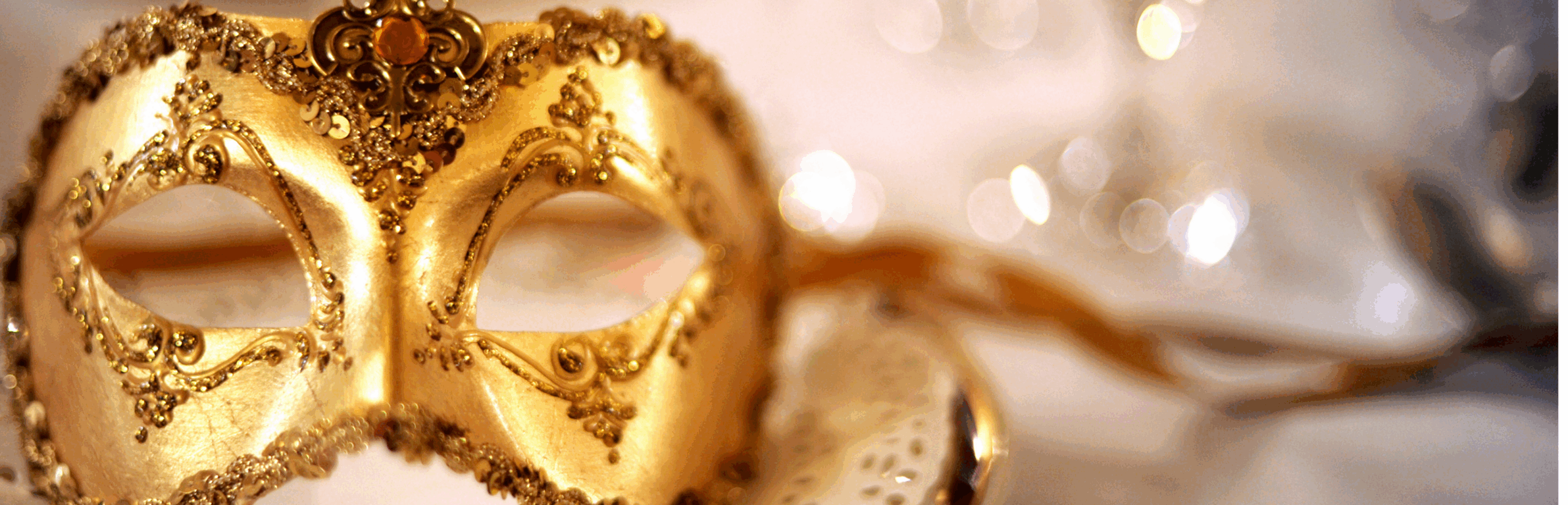 A gold mask on a dinner plate