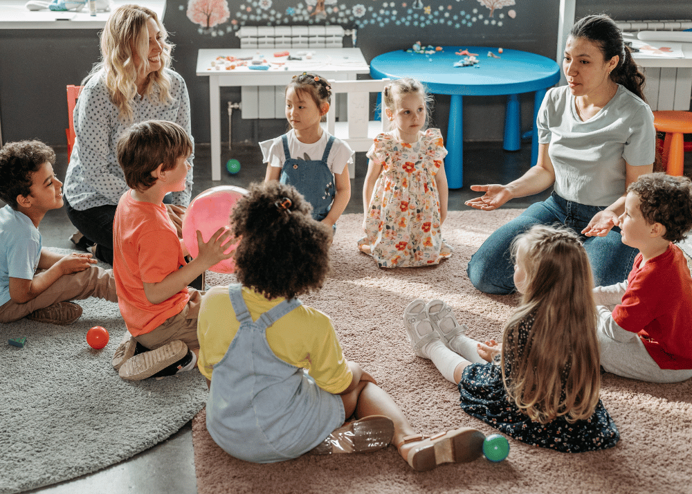 one woman observing day care class with teacher